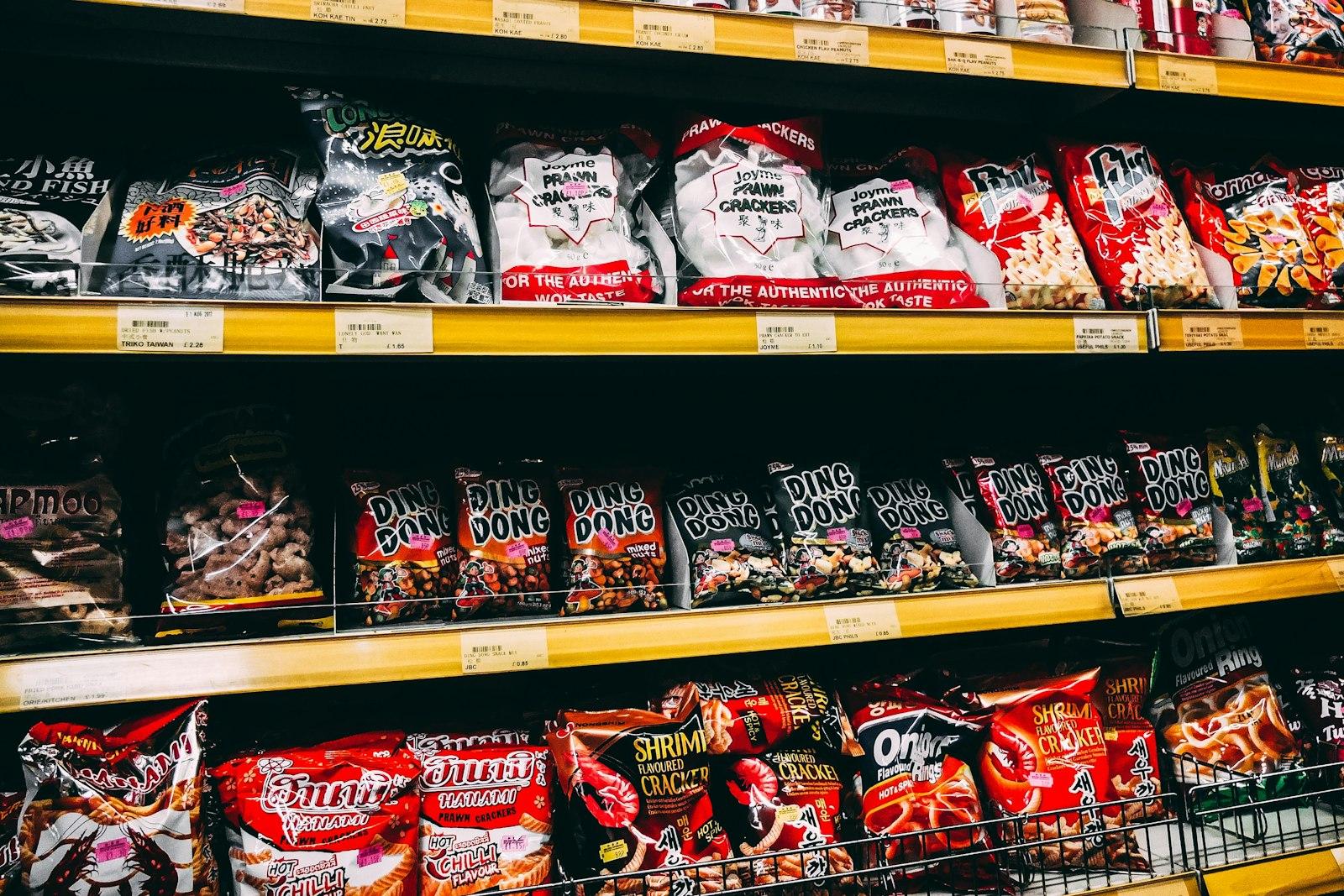 A supermarket shelf crowded with competing regional snack brands
